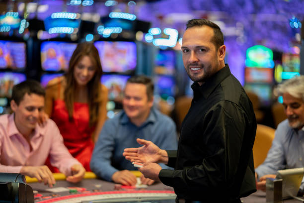Mobile phone displaying live roulette game with dealer spin visible on screen